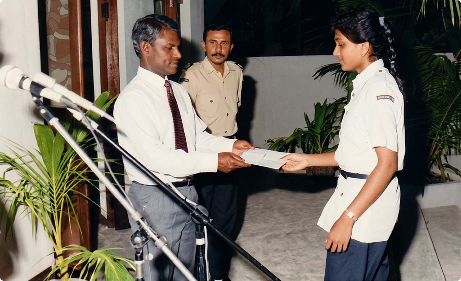 Fathimath Agisa receiving her rank insignia, 1990