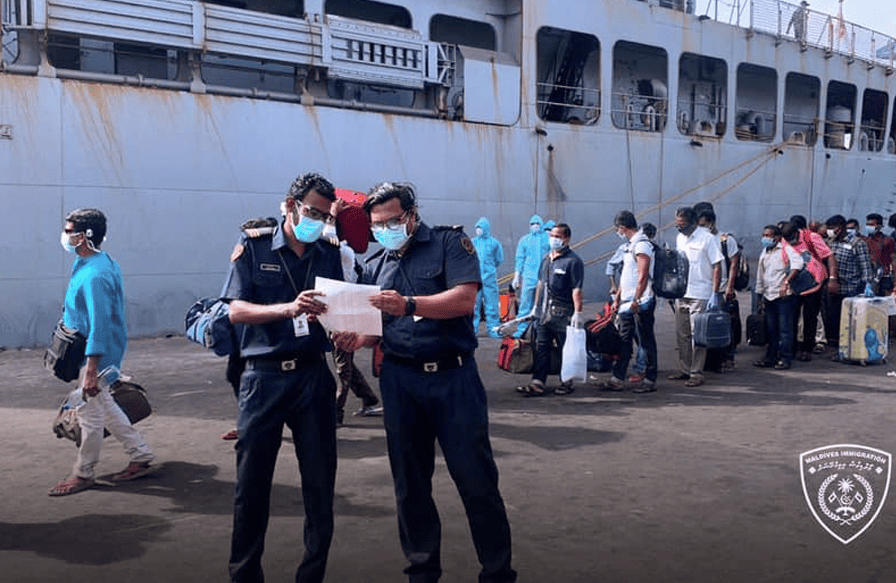 Officers assisting evacuees at a seaport